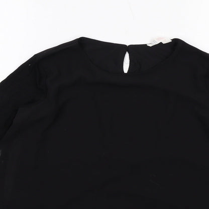 Close-up detail of H&M girls’ black polyester basic blouse, size 12-13, years round neck buckle