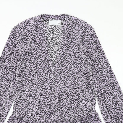 Close-up detail of ASOS women’s purple floral polyester a-line, size UK 4, v-neck pullover