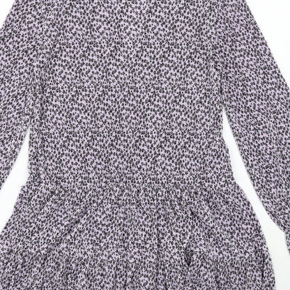 Brand and care label for ASOS women’s purple floral polyester a-line, size UK 4, v-neck pullover