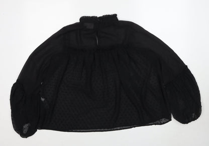 Back view of ASOS women’s black polka dot polyester basic blouse, size UK 10, round neck
