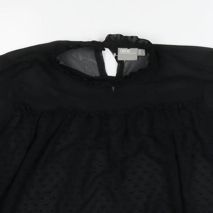 Close-up detail of ASOS women’s black polka dot polyester basic blouse, size UK 10, round neck