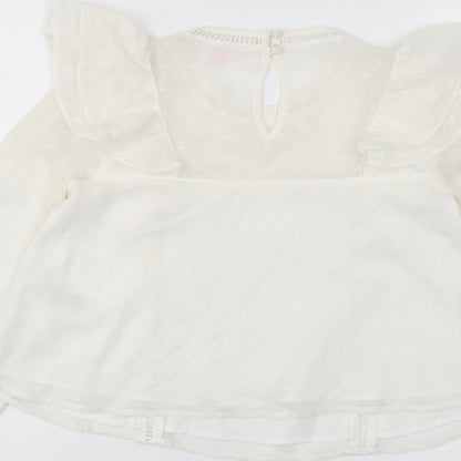 Brand and care label for Miss Selfridge women’s ivory polyester basic blouse, size UK 4, round neck