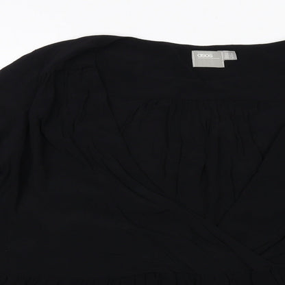 Close-up detail of ASOS women’s black viscose basic blouse, size UK 6, v-neck