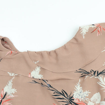 Close-up detail of Autograph women’s brown geometric polyester basic blouse, size UK 8, boat neck - leaf print