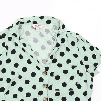 Close-up detail of Miss Selfridge women’s green polka dot viscose basic button-up, size UK 10, collared