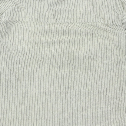 Brand and care label for BDG women’s green cotton basic button-up, size S, collared