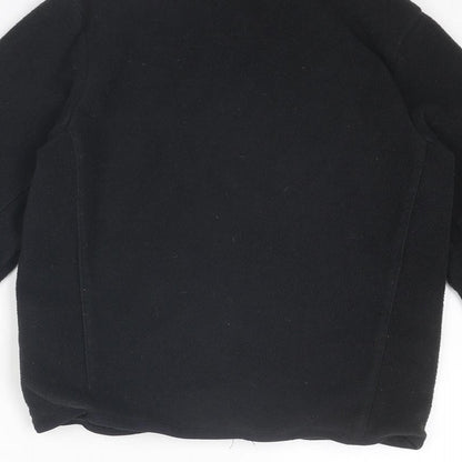 Brand and care label for Quechua boys’ black jacket, size 8, years zip