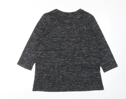 Back view of Dunnes women’s black striped polyester basic blouse, size M, round neck