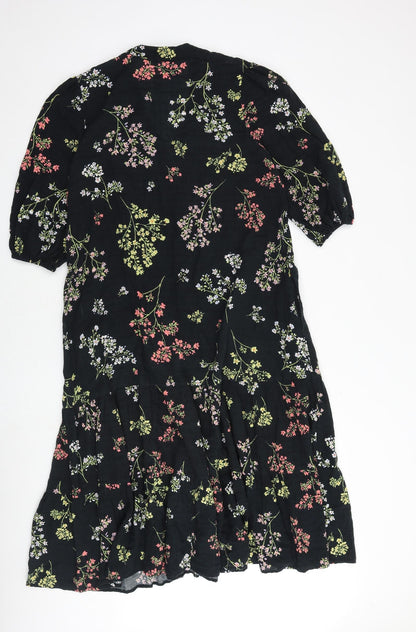 Back view of And/Or women’s black floral polyester a-line, size UK 10, v-neck button