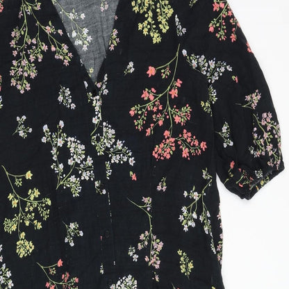 Close-up detail of And/Or women’s black floral polyester a-line, size UK 10, v-neck button
