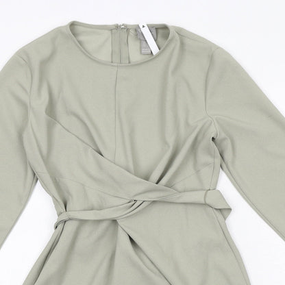Close-up detail of ASOS women’s green polyester a-line, size UK 6, round neck zip