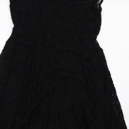 Brand and care label for ASOS women’s black floral nylon shift, size UK 14, round neck pullover