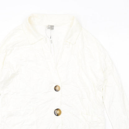 Close-up detail of ASOS women’s ivory cotton shirt dress, size UK 4, collared pullover