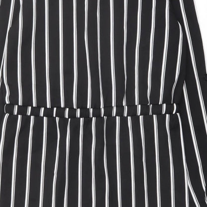 Brand and care label for Missguided women’s black striped polyester shirt dress, size UK 8, collared button