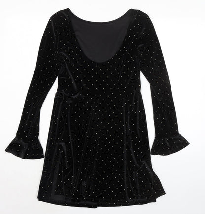 Back view of ASOS women’s black polka dot polyester a-line, size UK 8, round neck pullover