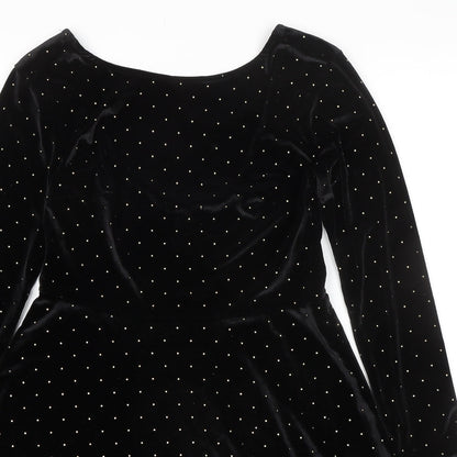 Close-up detail of ASOS women’s black polka dot polyester a-line, size UK 8, round neck pullover