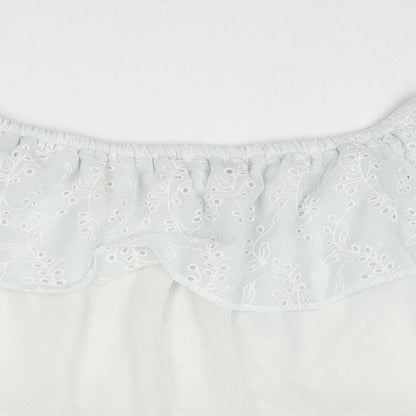 Close-up detail of Only women’s white polyester basic blouse, size UK 6, off the shoulder - broderie anglaise details