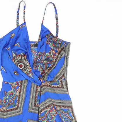Close-up detail of Missguided women’s blue geometric polyester mini, size UK 6, v-neck zip