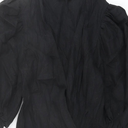 Close-up detail of ASOS women’s black polyester jacket dress, size UK 6, v-neck button