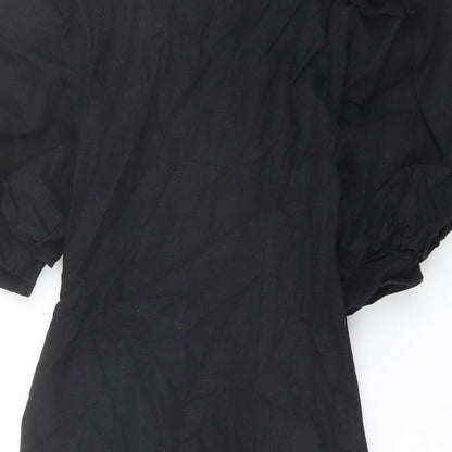 Brand and care label for ASOS women’s black polyester jacket dress, size UK 6, v-neck button