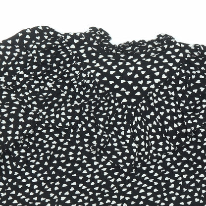 Close-up detail of Next girls’ black geometric viscose basic button-up, size 13, years v-neck button - heart pattern