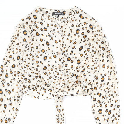 Close-up detail of Missguided women’s beige animal print polyester basic button-up, size UK 10, v-neck - leopard print