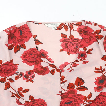 Close-up detail of Missguided women’s pink floral polyester basic button-up, size UK 8, v-neck - knot front