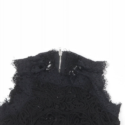 Close-up detail of Missguided women’s black polyester cropped blouse, size UK 6, round neck