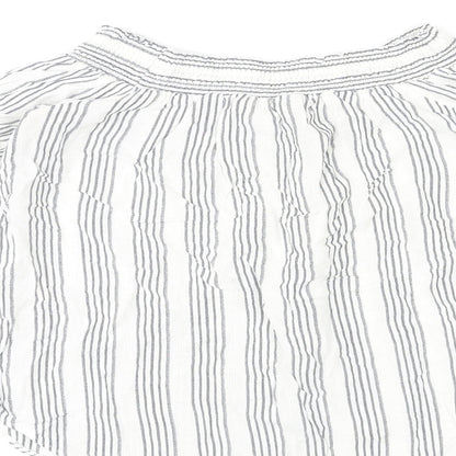 Brand and care label for Miss Selfridge women’s multicoloured striped polyester basic blouse, size UK 14, off the shoulder