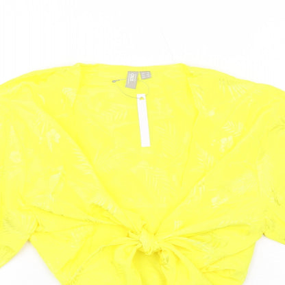 Close-up detail of ASOS women’s yellow geometric polyester basic blouse, size UK 8, v-neck - tie front detail