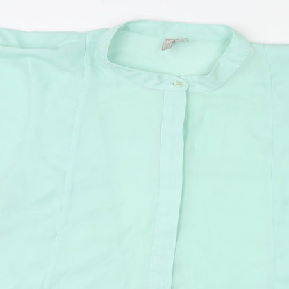 Close-up detail of ASOS women’s green polyester basic blouse, size UK 18, round neck