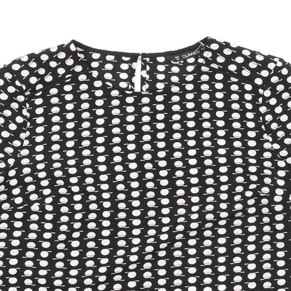 Close-up detail of Dunnes women’s black geometric polyester basic blouse, size XS, round neck