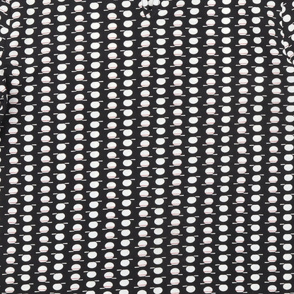 Brand and care label for Dunnes women’s black geometric polyester basic blouse, size XS, round neck