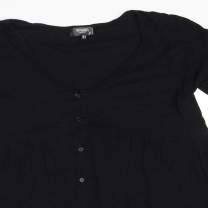 Close-up detail of Missguided women’s black polyester basic button-up, size UK 14, scoop neck