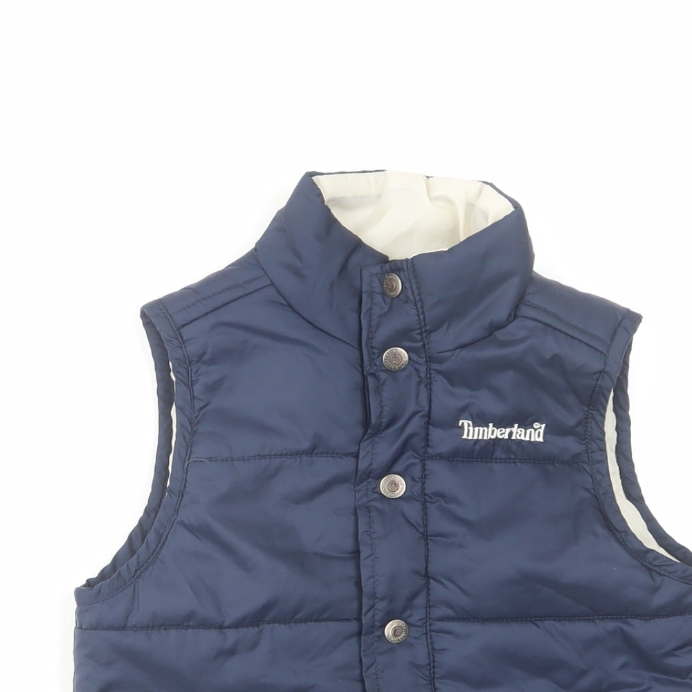 Close-up detail of Timberland boys’ blue gilet jacket, size 3, years zip