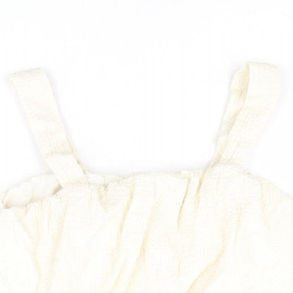 Close-up detail of Zara girls’ ivory polyester cropped blouse, size 10, years square neck pullover