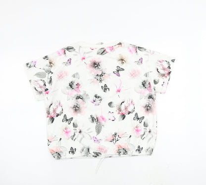 Back view of H&M girls’ white floral cotton basic blouse, size 11-12, years crew neck pullover