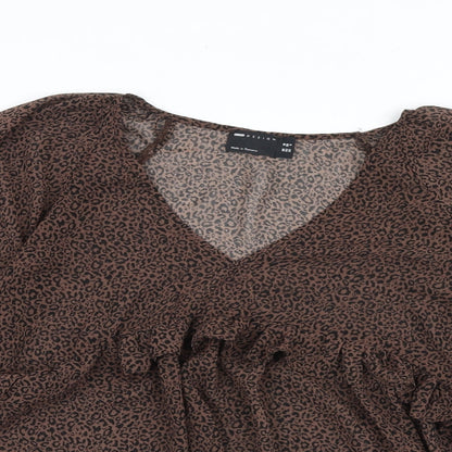 Close-up detail of ASOS women’s brown animal print polyester basic blouse, size UK 10, v-neck