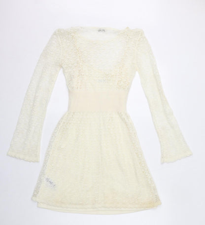 Back view of Miss Selfridge women’s ivory acrylic fit & flare, size UK 10, boat neck pullover