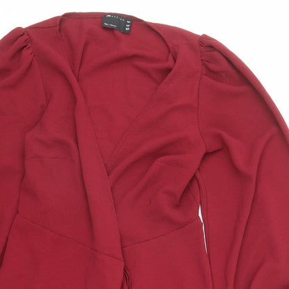 Close-up detail of ASOS women’s red polyester kimono blouse, size UK 12, collared