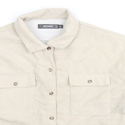 Close-up detail of Missguided women’s beige jacket, size UK 6, button