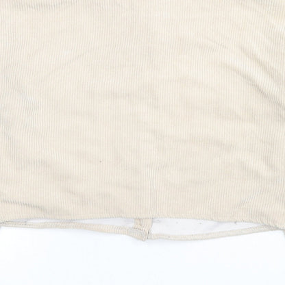 Brand and care label for Missguided women’s beige jacket, size UK 6, button