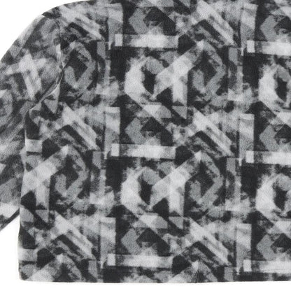 Brand and care label for Eddie Bauer girls’ grey geometric jacket, size 10-11, years zip