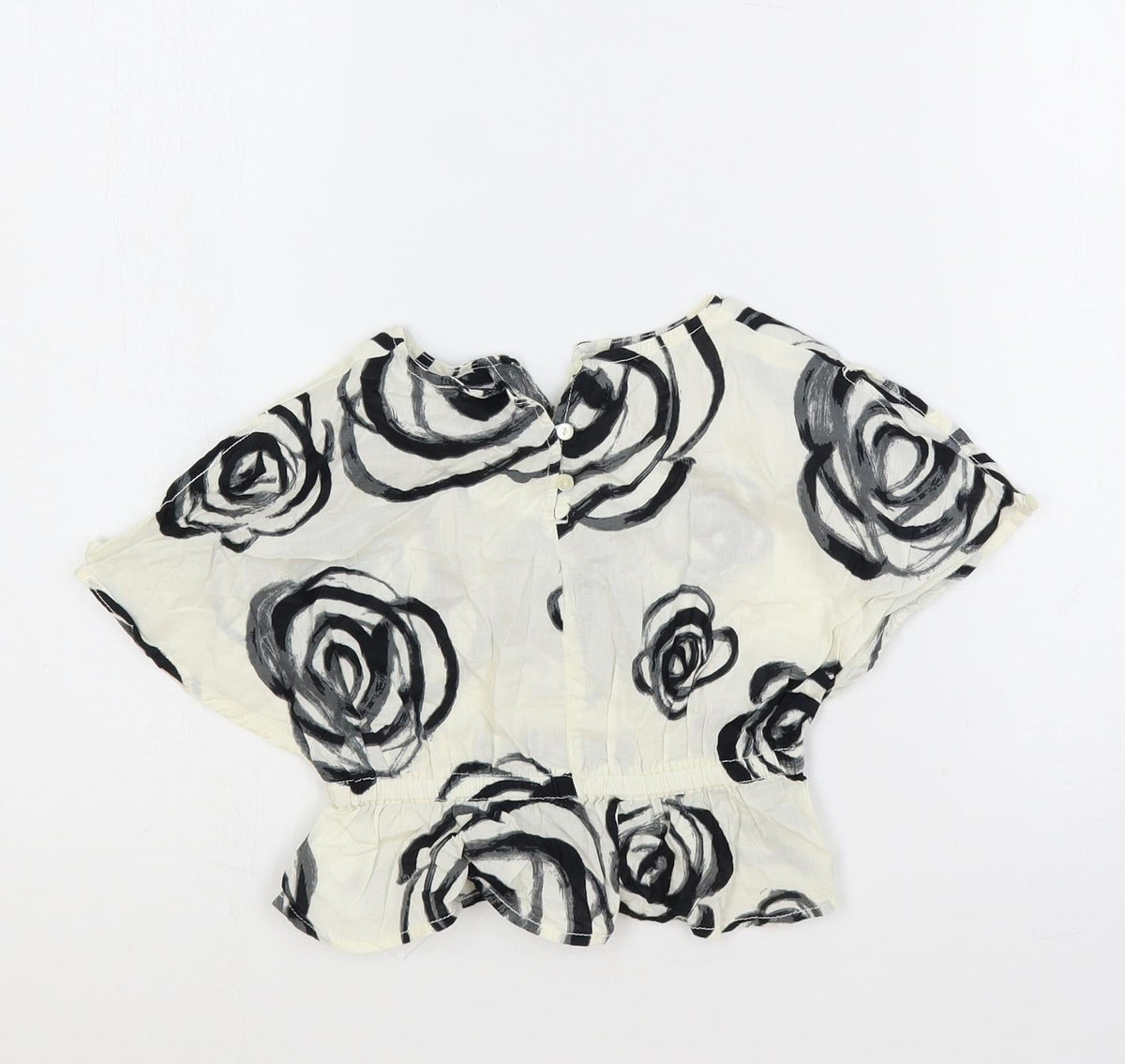 Back view of Gap girls’ ivory floral cotton pullover blouse, size 18-24, months round neck button