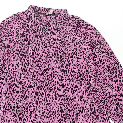 Close-up detail of ASOS women’s pink animal print polyester mini, size UK 10, mock neck pullover - leopard print