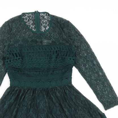 Close-up detail of ASOS women’s green polyamide fit & flare, size UK 6, round neck zip