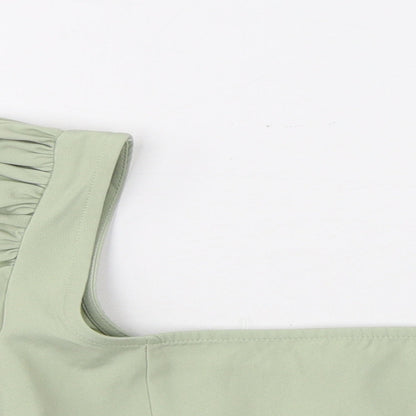 Close-up detail of Missguided women’s green polyester cropped t-shirt, size UK 8, square neck