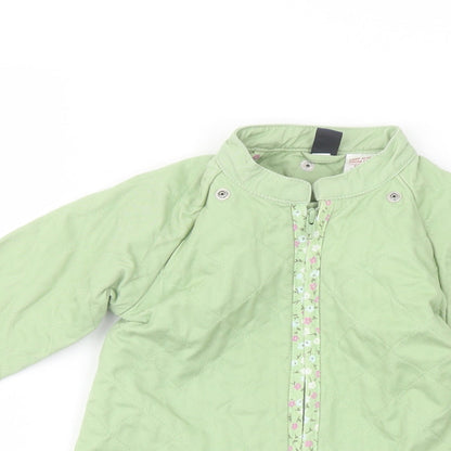 Close-up detail of Gap girls’ green jacket, size 3, years zip
