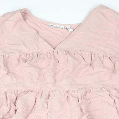 Close-up detail of ASOS women’s pink polyester basic blouse, size UK 6, v-neck - smocked