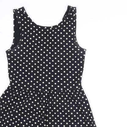 Close-up detail of Only women’s black polka dot polyester a-line, size S, round neck pullover